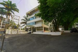 a parking lot in front of a building at Tiger Hill Hotel & Suites in Kalpetta