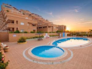 a large swimming pool in front of a building at Apartalux Magic Platinum in Oropesa del Mar