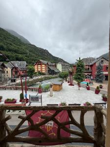 a view of a town with a fountain and buildings at Hotel Europa Les by Dynamic Hotels in Les