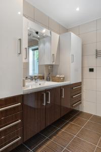 a bathroom with a sink and a mirror at Hus i Stryn med utsikt in Stryn +52 photos