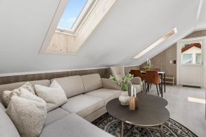 a living room with a couch and a table at Hus i Stryn med utsikt in Stryn