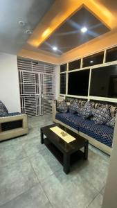 a living room with a couch and a coffee table at Vihari Luxury Resort in Alamanda