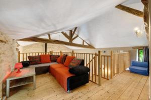 a living room with a couch and a table at Gîtes Du Logis De Bourseguin in Bourneau +52 photos
