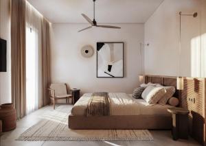 a bedroom with a bed and a ceiling fan at Breaq Santorini - Margarita Hotel in Firostefani