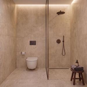 a bathroom with a shower with a toilet in it at Breaq Santorini - Margarita Hotel in Firostefani