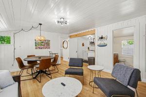 a living room with a table and chairs at Union Retreat in Douglas
