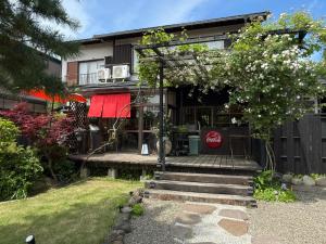 a house with a staircase leading to the front of it at HOUSE26 Private Villa near Green Expo Yokohama in Machida