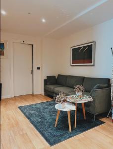 a living room with a couch and a table at SAINT MICHEL in Gorizia