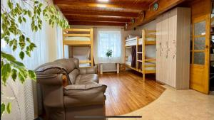 a living room with a couch and bunk beds at хостел Галіція in Kolomiya