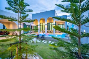a rendering of a building with palm trees in front at CC POOL VILLA พลูวิลล่าcha-am in Cha Am