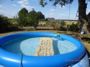a pool with a bunch of inflatables in a yard at 29 Haster Straße in Bad Nenndorf