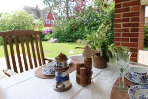 a table with a figurine of a lighthouse on it at Ferienhaus Uli in Wustrow