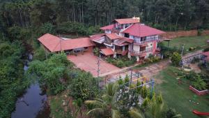 an aerial view of a large house with red roofs at DELIGHTFUL HOMESTAY in Sollebail