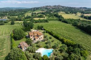 an aerial view of a house in a vineyard at Podere Il Pozzangone by Geco Vacation Rentals in Lucignano