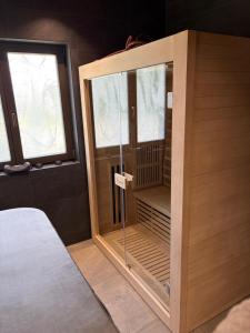 a room with a sauna in a bedroom at Chalupa Sandra in Vítějeves