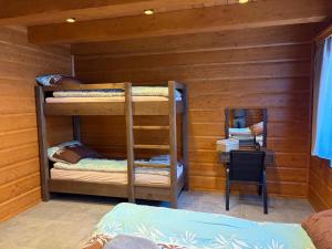 a room with two bunk beds in a cabin at Chalupa Sandra in Vítějeves +41 photos