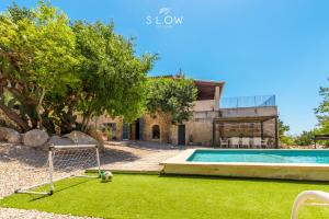 an image of a villa with a pool and a soccer ball at Villa Bandris by Slow Villas in Manacor