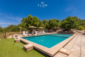an image of a swimming pool in a yard at Villa Bandris by Slow Villas in Manacor +38 photos