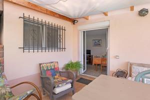 a room with chairs and a table and a dining room at Gîte rural chez Michel in Soulatgé +19 photos