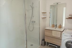 a bathroom with a shower with a glass door at Spacious and bright 125m2 apartment in Berck in Berck-sur-Mer