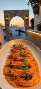 a white plate of food on a table at Knossos Breeze in Sitia