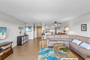 a living room with a couch and a table at Keauhou Punahele#D-206 in Kailua-Kona