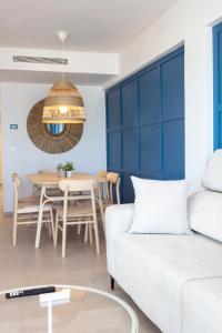 a living room with a couch and a table at AG LAS SIRENAS in Playa de Gandia
