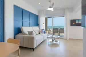 a living room with a couch and a table at AG LAS SIRENAS in Playa de Gandia