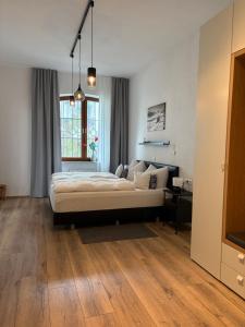 a bedroom with a bed and a large window at Haus Pürner in Reit im Winkl