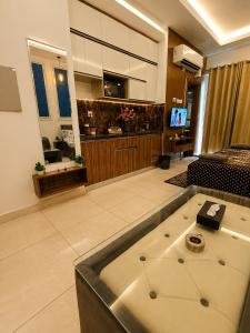 a large room with a bath tub in a salon at Darshana Studios#Cozy in Noida