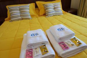 Postel nebo postele na pokoji v ubytování Ceferino Hotel