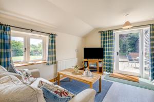a living room with a couch and a table at 2 Bed in Denton oc-b42753 in Kenton