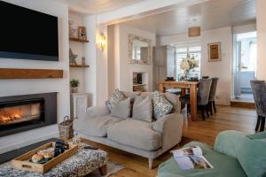 a living room with a couch and a fireplace at 2 Bed in Mumbles oc-t42823 in The Mumbles