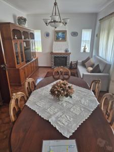 a living room with a table and chairs and a couch at Vivenda Atlantico in Vila Praia de Âncora