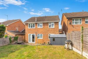 a house with a fence in a yard at Badger Haven, Apartment 3 in Brackley