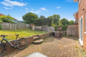 a bike parked in the backyard of a house at Badger Haven, Apartment 3 in Brackley