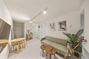 a living room with a couch and a table at Chic One Bedroom Retreat in Downtown Manhattan in New York +7 photos