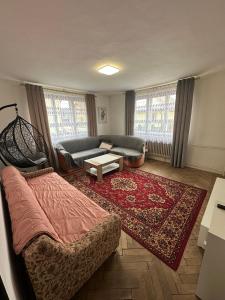 a living room with a couch and a rug at DáMa in Ružomberok