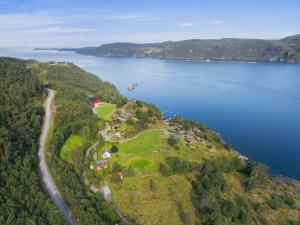 an island in the middle of a body of water at Cabin in Hjelmeland in Hjelmeland