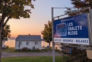 a sign in front of a house with a house at Chalet Studio #12 - Relaxing getaway with Wifi & AC in Cap-Saint-Ignace +25 photos