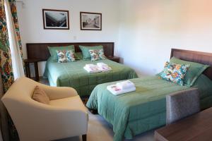 Postel nebo postele na pokoji v ubytování Ceferino Hotel