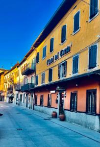 a yellow building with a sign on it on a street at Hotel del Corso in Sestola