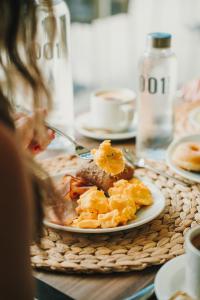 a plate of food sitting on a table at 001 HIGOS BEACH BOUTIQUE Singular Hotel Residence in Costa Calma +107 photos