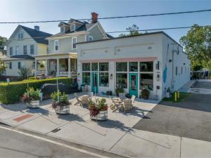 a building with plants in front of a house at Downtown Heritage Suite - Free Parking in Macon