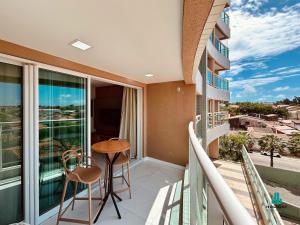 a balcony of a condo with a table and chairs at Fortaleza Sul Prime By Holiday Stays in Fortaleza