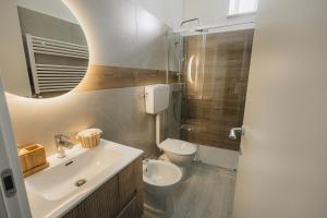 a bathroom with a sink and a toilet at Casa Anastasia Beach Loft in Montesilvano