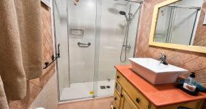 a bathroom with a sink and a shower at Casa Nayroa by Spainsunrentals 1019 in Nerja +13 photos