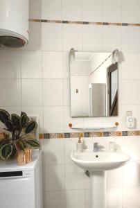a bathroom with a sink and a mirror at Villa Seashell in Prčanj +63 photos