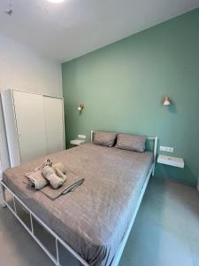 a bedroom with a bed with two towels on it at The WhiteHouse in Agia Triada