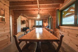 a conference room with a wooden table and chairs at Gites de la Semois in Laviot
